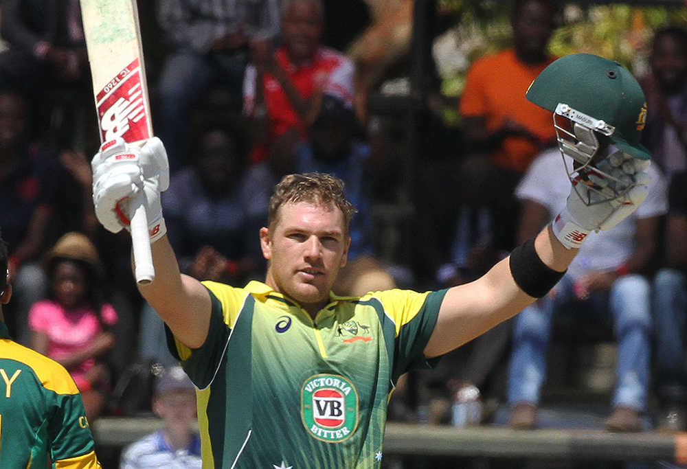 Australian batsman Aaron Finch celebrates after scoring a century, during the One Day International cricket match against South Africa in Harare Zimbabwe Wednesday, Aug. 27, 2014. The two teams are competing in a triangular ODI series with Zimbabwe. (AP Photo/Tsvangirayi Mukwazhi)