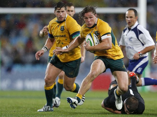 Michael Hooper breaks free from a tackle