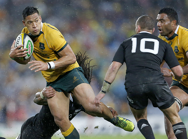 Israel Folau gets caught up in some heavy defence during the opening game of the series between the Wallabies and the All Blacks at ANZ Stadium in Sydney, Saturday, Aug. 16, 2014. (Photo: Paul Barkley/LookPro)