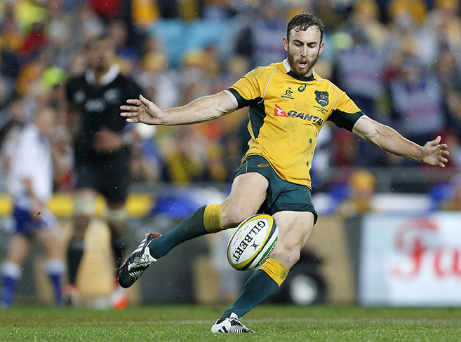 Nic White kicks the ball during the opening game of the series between the Wallabies and the All Blacks at ANZ Stadium in Sydney, Saturday, Aug. 16, 2014. (Photo: Paul Barkley/LookPro)