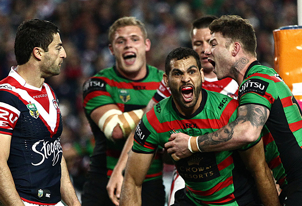 Rabbitohs player Greg Inglis celebrates after scoring a try during the NRL Preliminary final between the South Sydney Rabbitohs and the Sydney Roosters at ANZ Stadium in Sydney, Friday, Sept. 26, 2014. (AAP Image/Action Photographics, Colin Whelan)