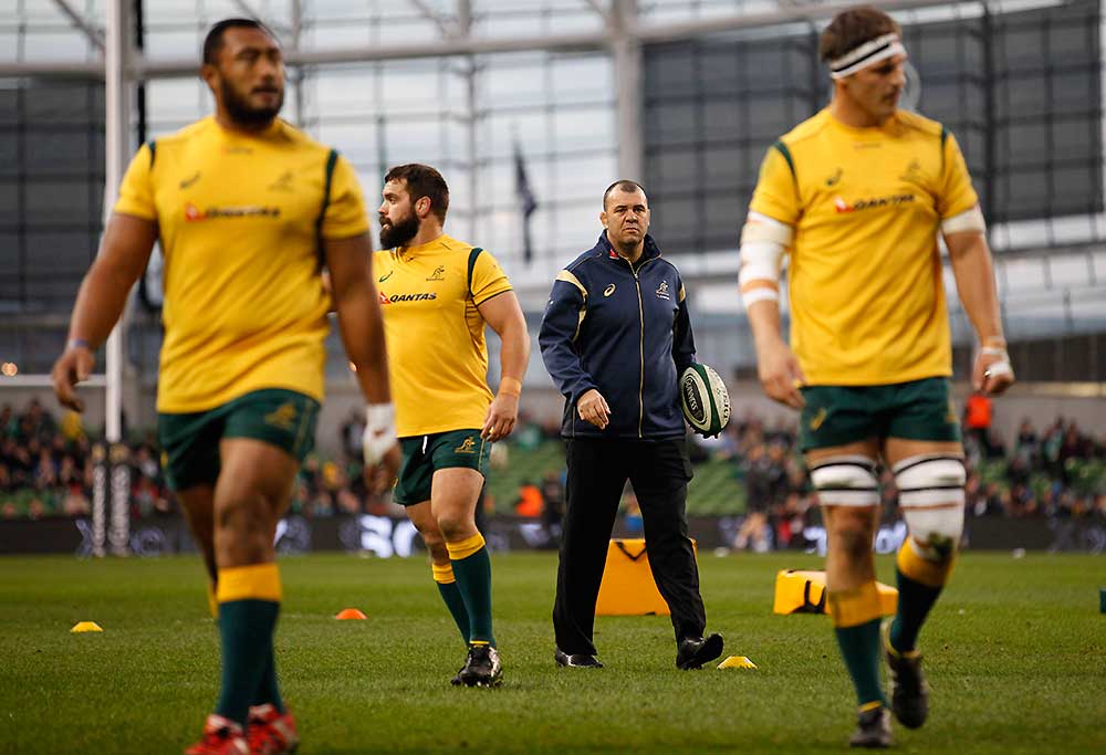 Australia's head coach Michael Cheika, second right, walks with his side before playing Ireland