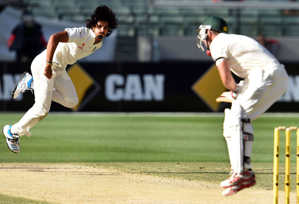 Ishant Sharma (L) hits Australia's batsman Shaun Marsh