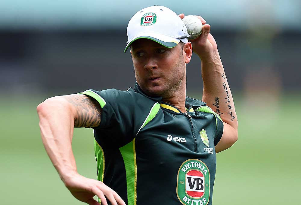 Michael Clarke returns the ball during a training session