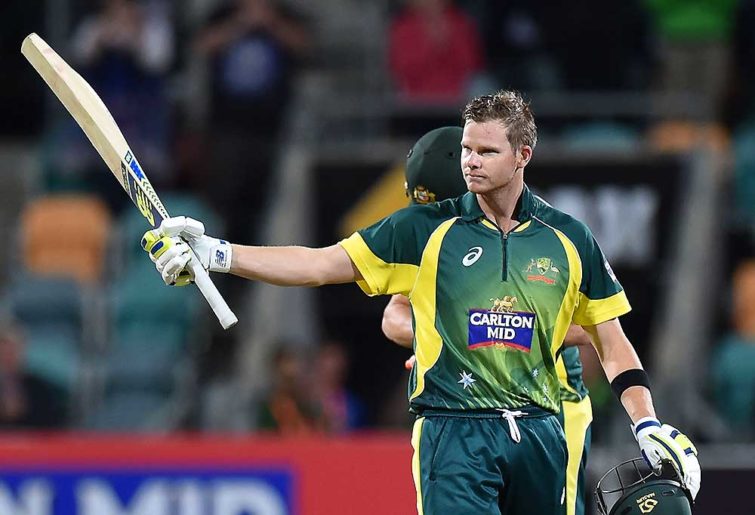 Australia's Steven Smith raises his bat after scoring a century