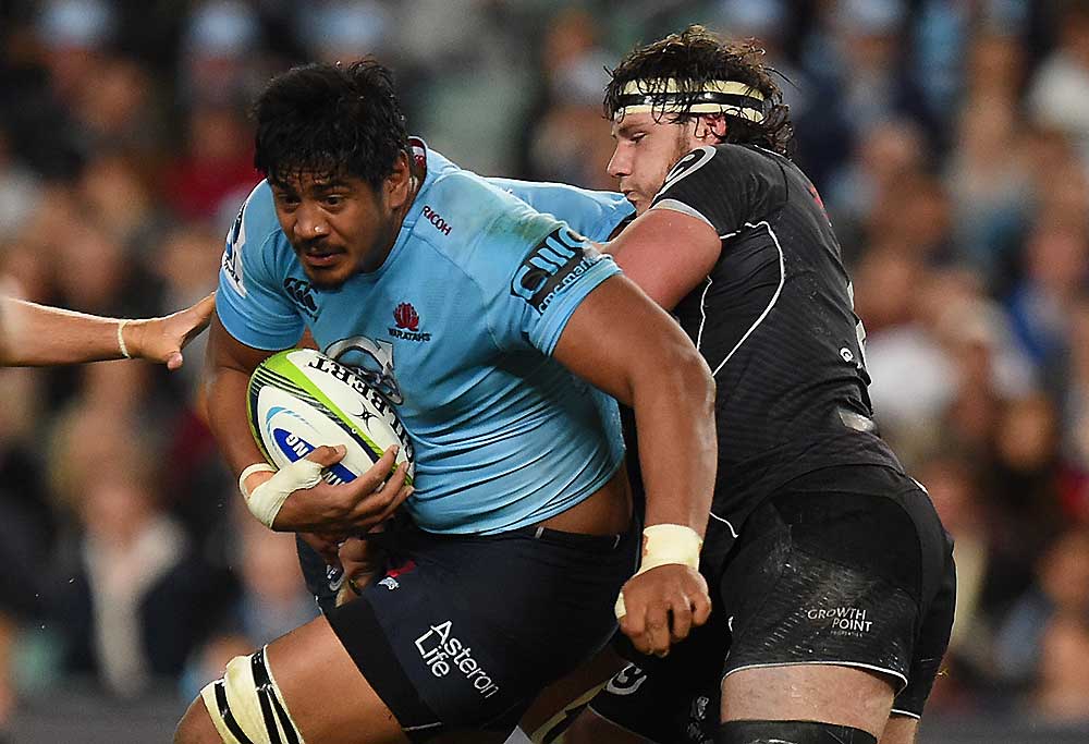 Will Skelton of the Waratahs is tackled by Marcell Coetzee of the Sharks