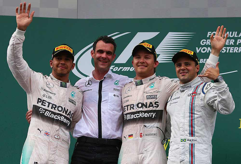 Lewis Hamilton (GBR/ Mercedes GP), a Mercedes crew member, Nico Rosberg (GER/ Mercedes GP) and Felipe Massa