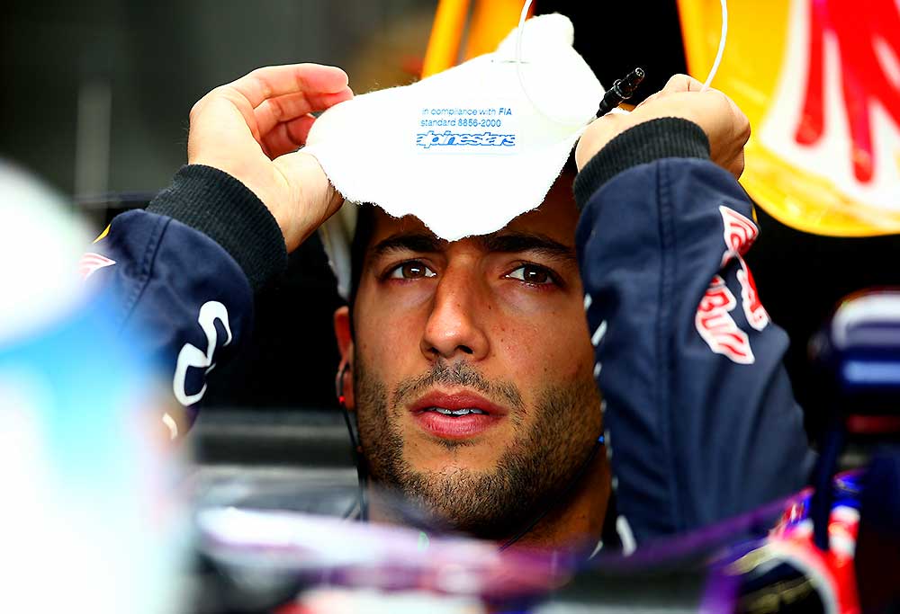 Daniel Ricciardo of Australia and Infiniti Red Bull Racing prepares in his car