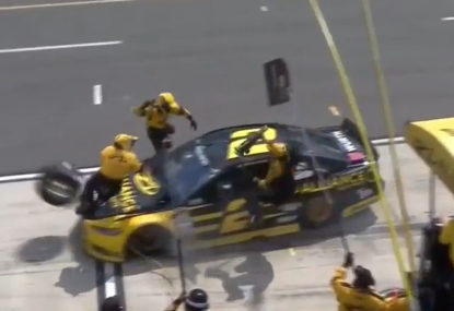 NASCAR driver runs over own pit crew