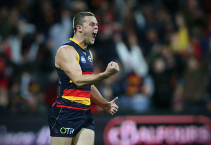 Crows crush Tigers to stay No.1