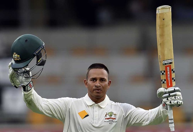 Australia's batsman Usman Khawaja celebrates his first Test century