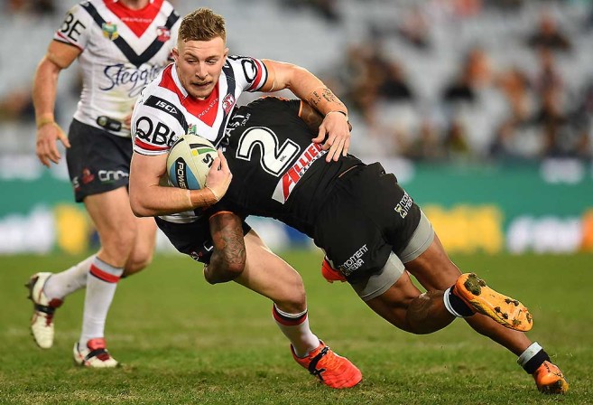Tigers winger tackles Jackson Hastings of the Roosters