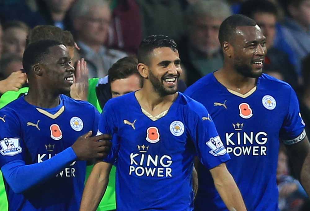Leicester City's Riyad Mahrez, center, celebrates