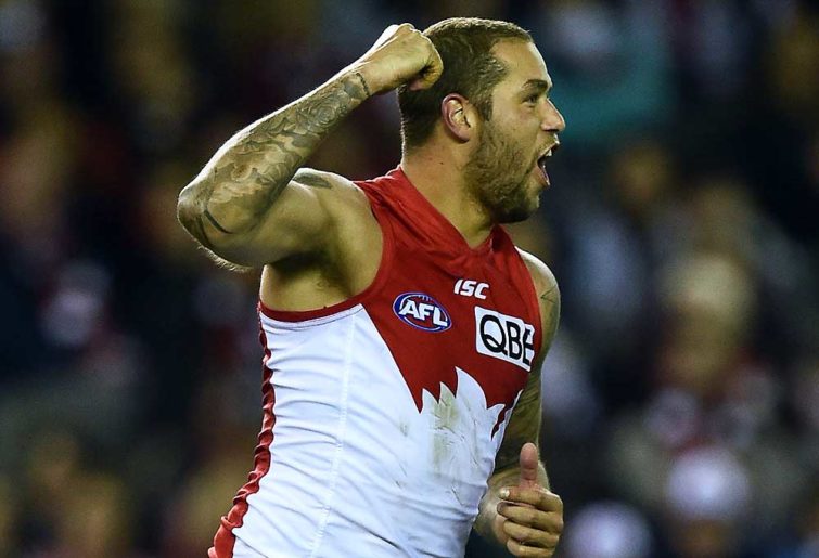 Sydney Swans player Lance Franklin reaches after kicking a goal