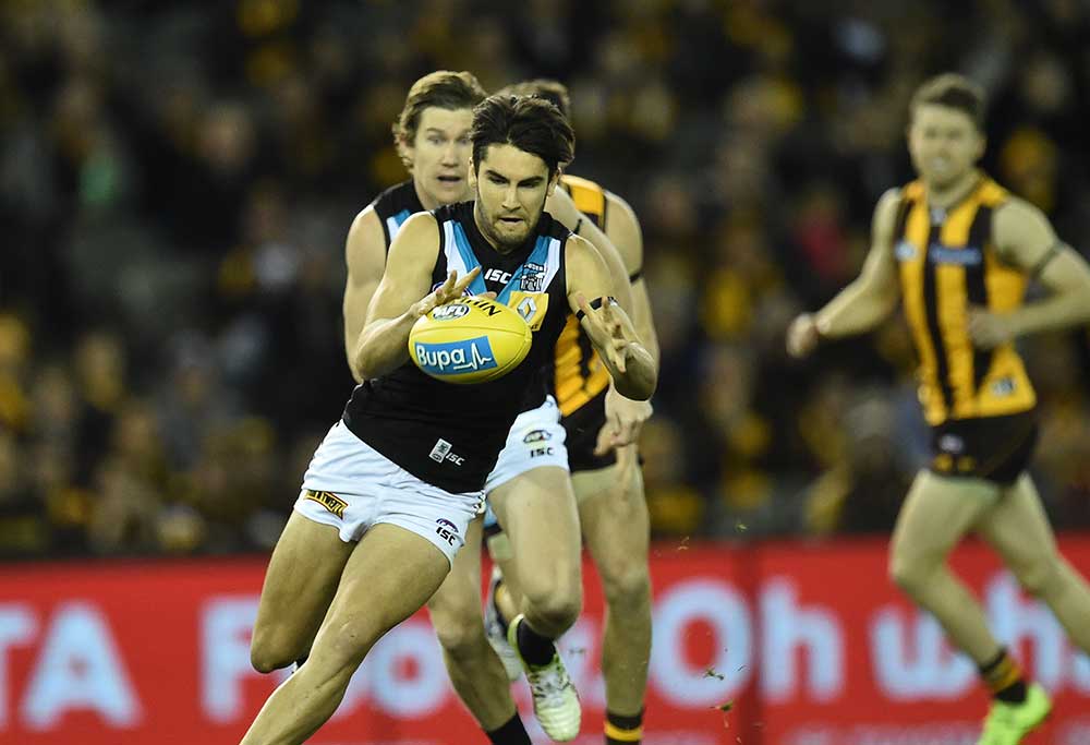 Port Adelaide Power player Chad Wingard (left) possess the ball against the Hawthorn Hawks