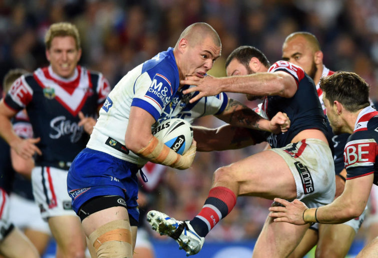 David Klemmer of the Bulldogs is tackled by Boyd Cordner