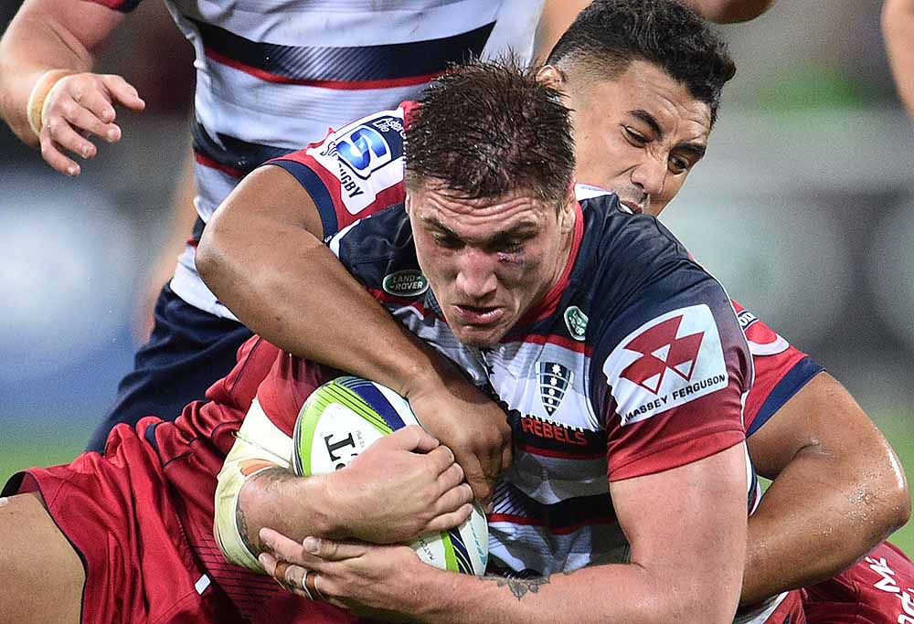 Sean McMahon of the Melbourne Rebels is tackled