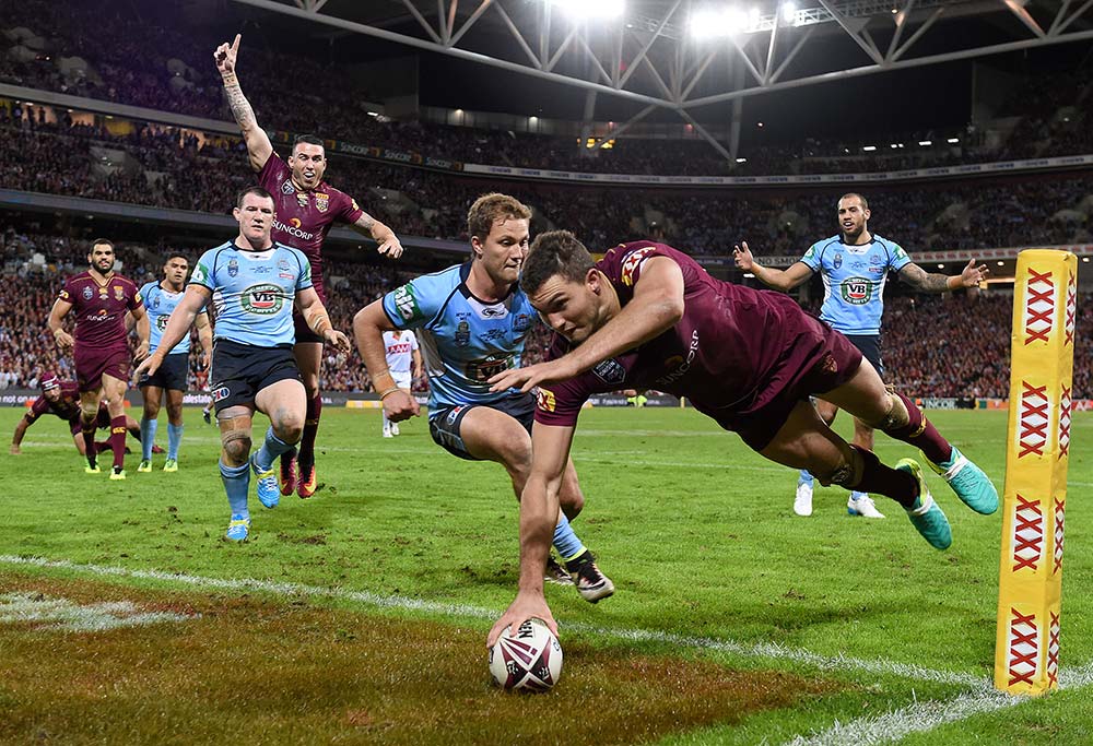 Maroons player Corey Oates crosses over to score
