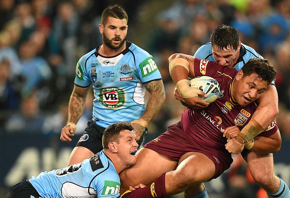 Josh Papalii of the Maroons is tackled by Greg Bird and Joshua Jackson of the Blues