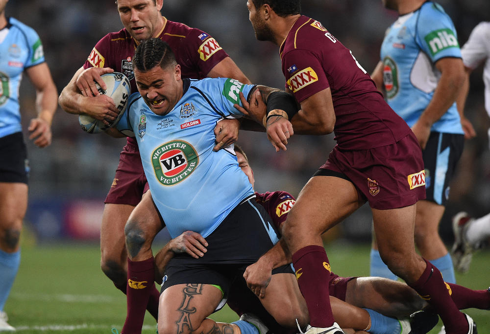 Andrew Fifita of the Blues is tackled by Cameron Smith, Gavin Cooper and Justin O'Neill