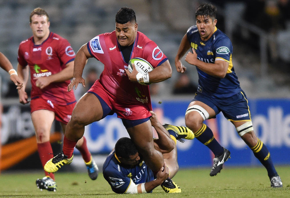 Scott Sio of the Brumbies tackles Taniela Tupou of the Reds during the round 15 Super Rugby match between the ACT Brumbies and the Queensland Reds at GIO Stadium in Canberra, Friday, July 1, 2016. (AAP Image/Dean Lewins)