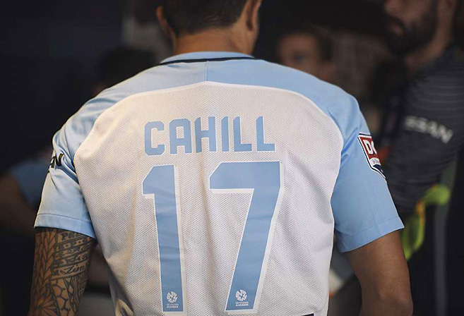 Tim Cahill tries on his Melbourne City jersey.