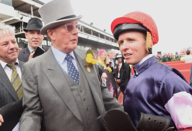 Jockey Kerrin McEvoy (right) with owner Llyod Williams after their win with Almandin in the Melbourne Cup on Melbourne Cup Day at Flemington Racecourse in Melbourne, Tuesday. Nov. 1, 2016.