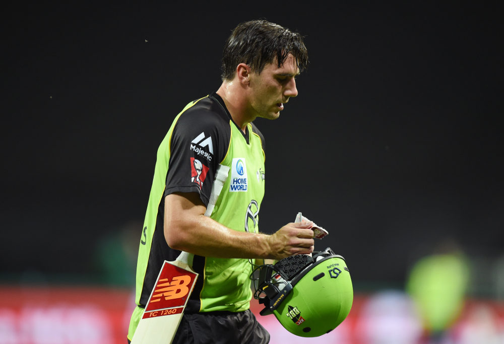Pat Cummins exits the field after being dismissed in the Big Bash