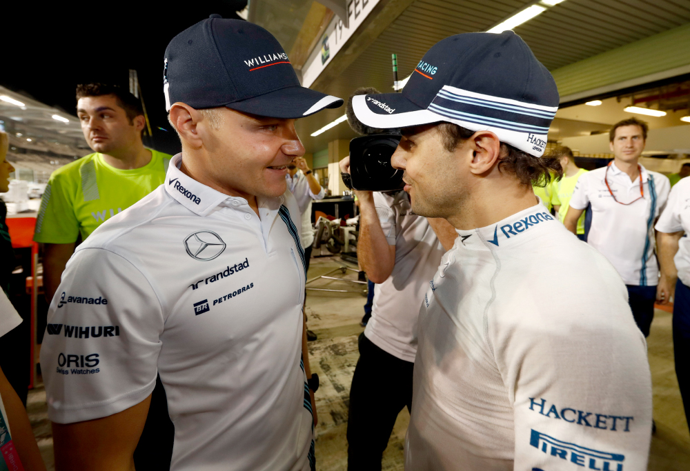 Williams driver Valtteri Bottas congratulates outgoing teammate Felipe Massa on his retirement at the 2016 Abu Dhabi Grand Prix.