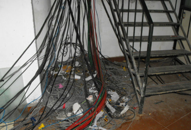 A mish mash of cables in the media centre at Chinnaswamy Stadium, Bangalore 2004.