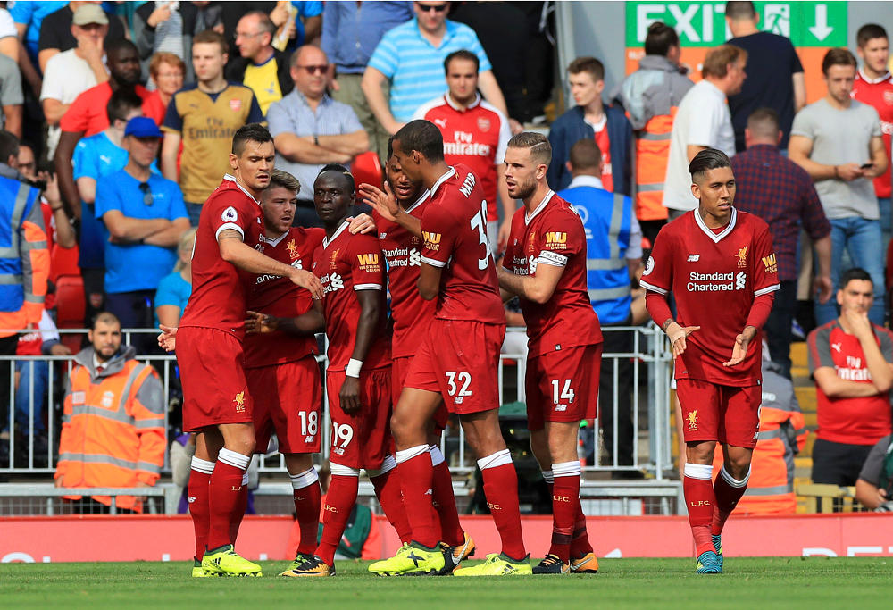 Liverpool's Sadio Mane celebrates scoring his side's second goal of the game with team mates during the Premier League match at Anfield, Liverpool. PRESS ASSOCIATION Photo. Picture date: Sunday August 27, 2017. See PA story SOCCER Liverpool. Photo credit should read: Peter Byrne/PA Wire.