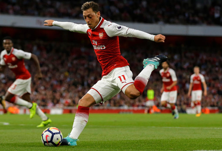 Arsenal's Mesut Ozil takes a shot on goal during their English Premier League soccer match between Arsenal and Leicester City at the Emirates stadium in London, Friday, Aug. 11, 2017.