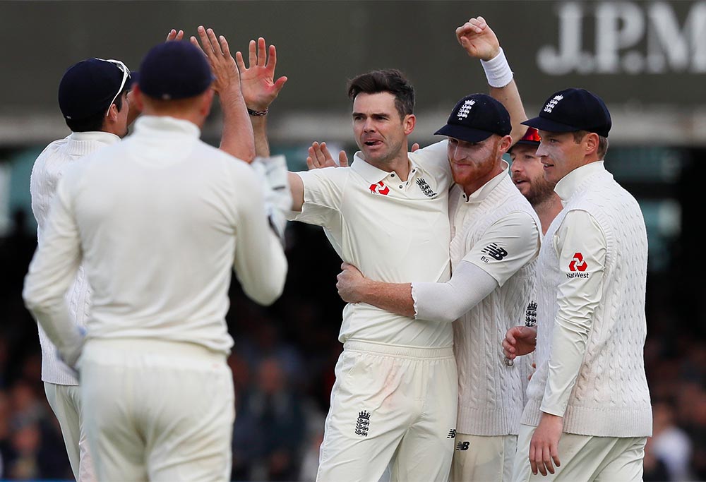 England's James Anderson, centre, celebrates taking a wicket