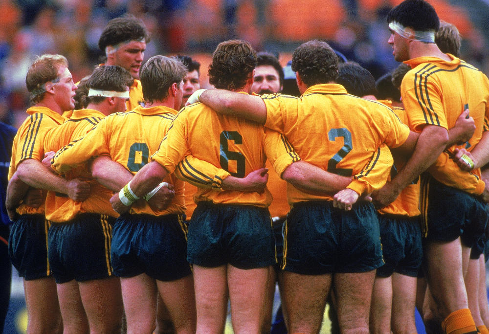 The Wallabies stand in a group huddle before the start of the Rugby World Cup match between the Australian Wallabies and Wales in Sydney, Australia. Australia won the match 33 - 15.