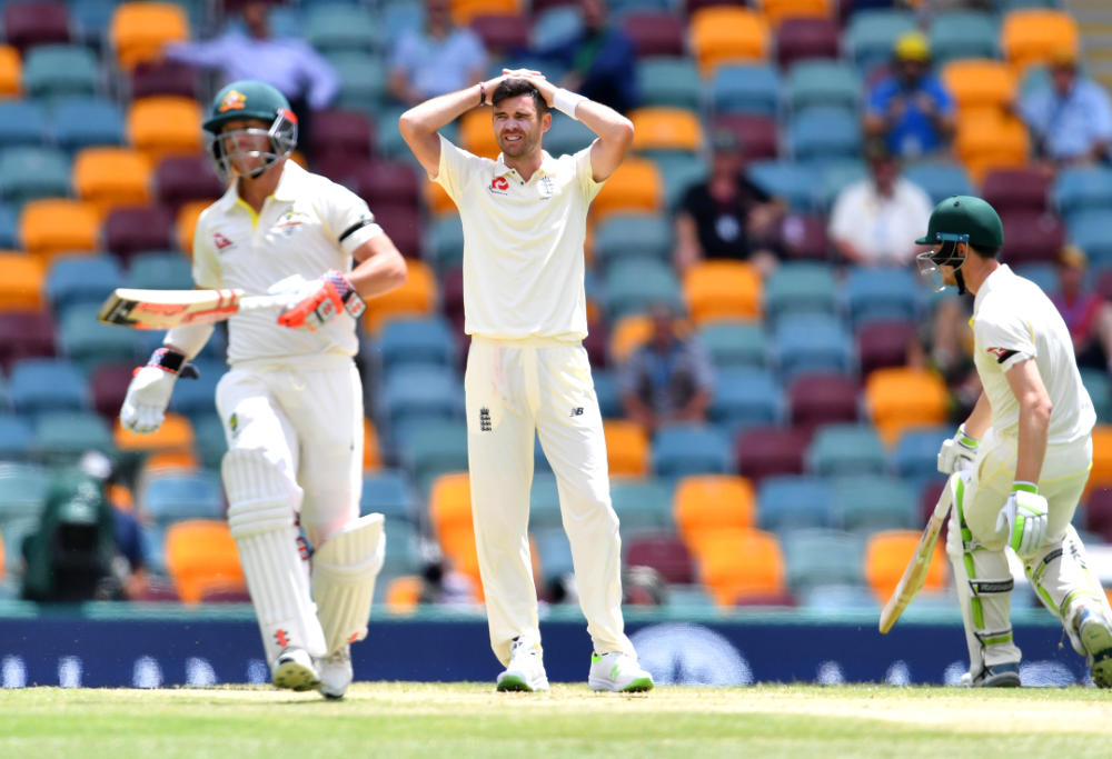 James Anderson (centre) of England reacts as Australian batsmen David Warner (left) and Cameron Bancroft (right) make runs on Day 5 of the First Ashes Test match between Australia and England at the Gabba in Brisbane, Monday, November 27, 2017.