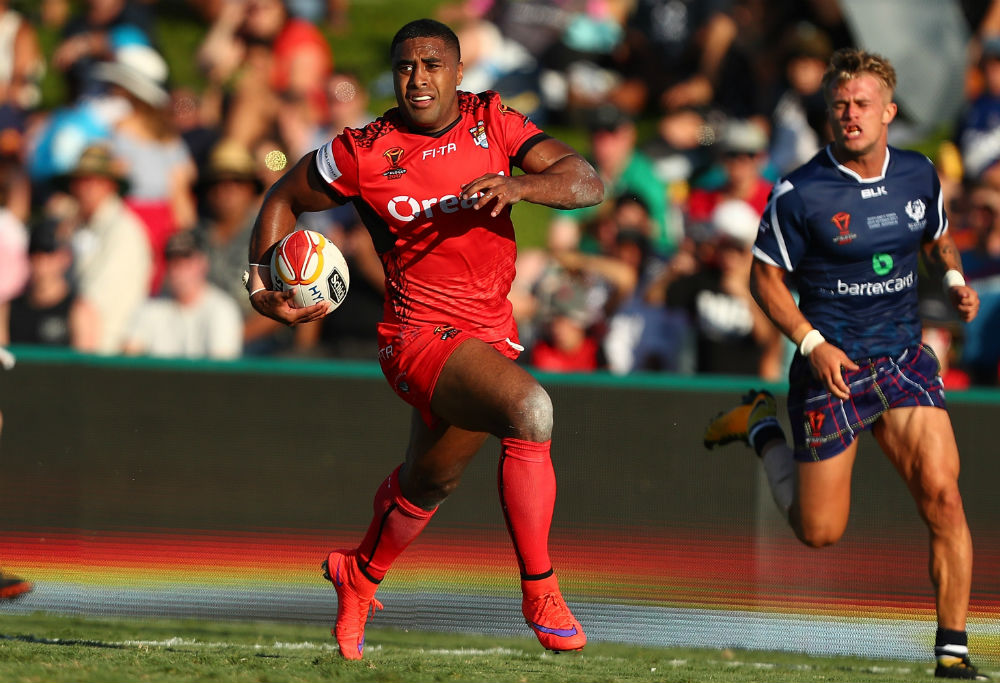 Michael Jennings makes a break for Tonga