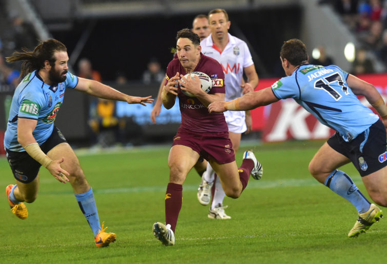 Billy Slater attempts to elude defenders.