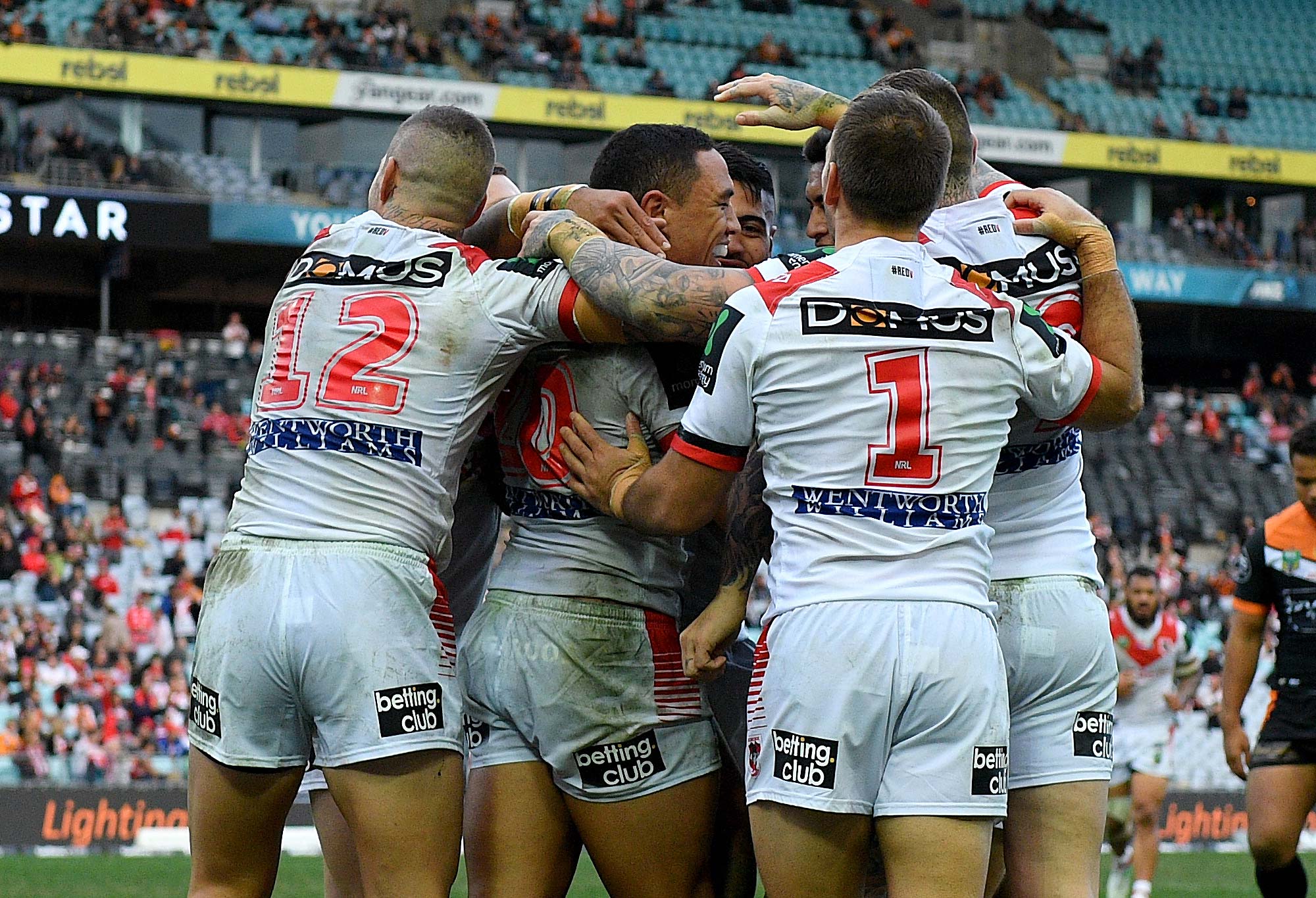 Tyson Frizell of the Dragons celebrates with team mates after scoring a try