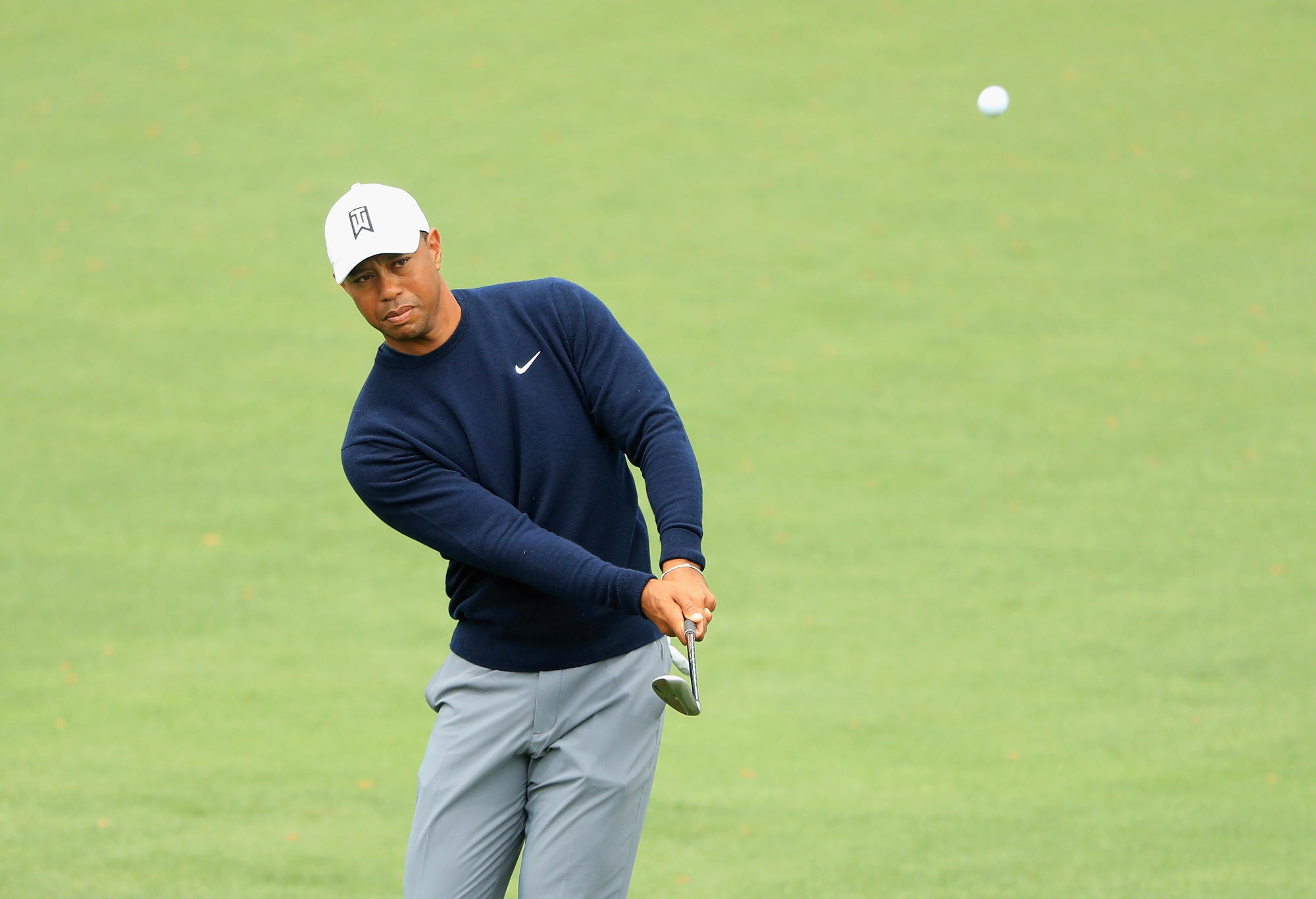 Tiger Woods of the United States plays a shot on the second hole during a practice round prior to the start of the 2018 Masters Tournament at Augusta National Golf Club on April 4, 2018 in Augusta, Georgia.
