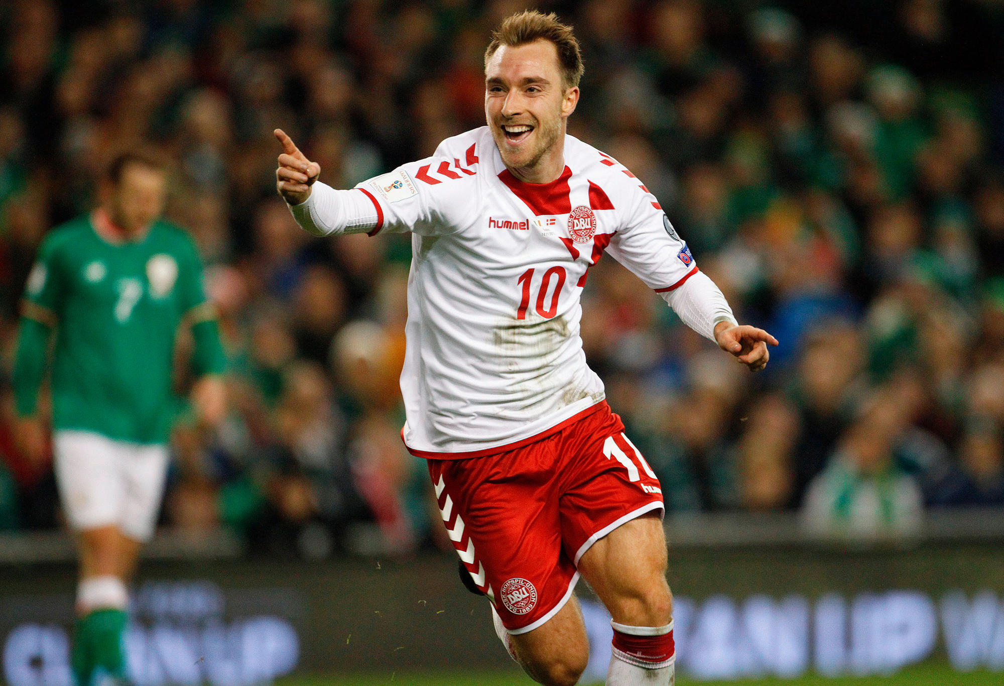 Denmark's Christian Eriksen celebrates after scoring his side's third goal during the World Cup qualifying play off second leg soccer match between Ireland and Denmark at the Aviva Stadium in Dublin.