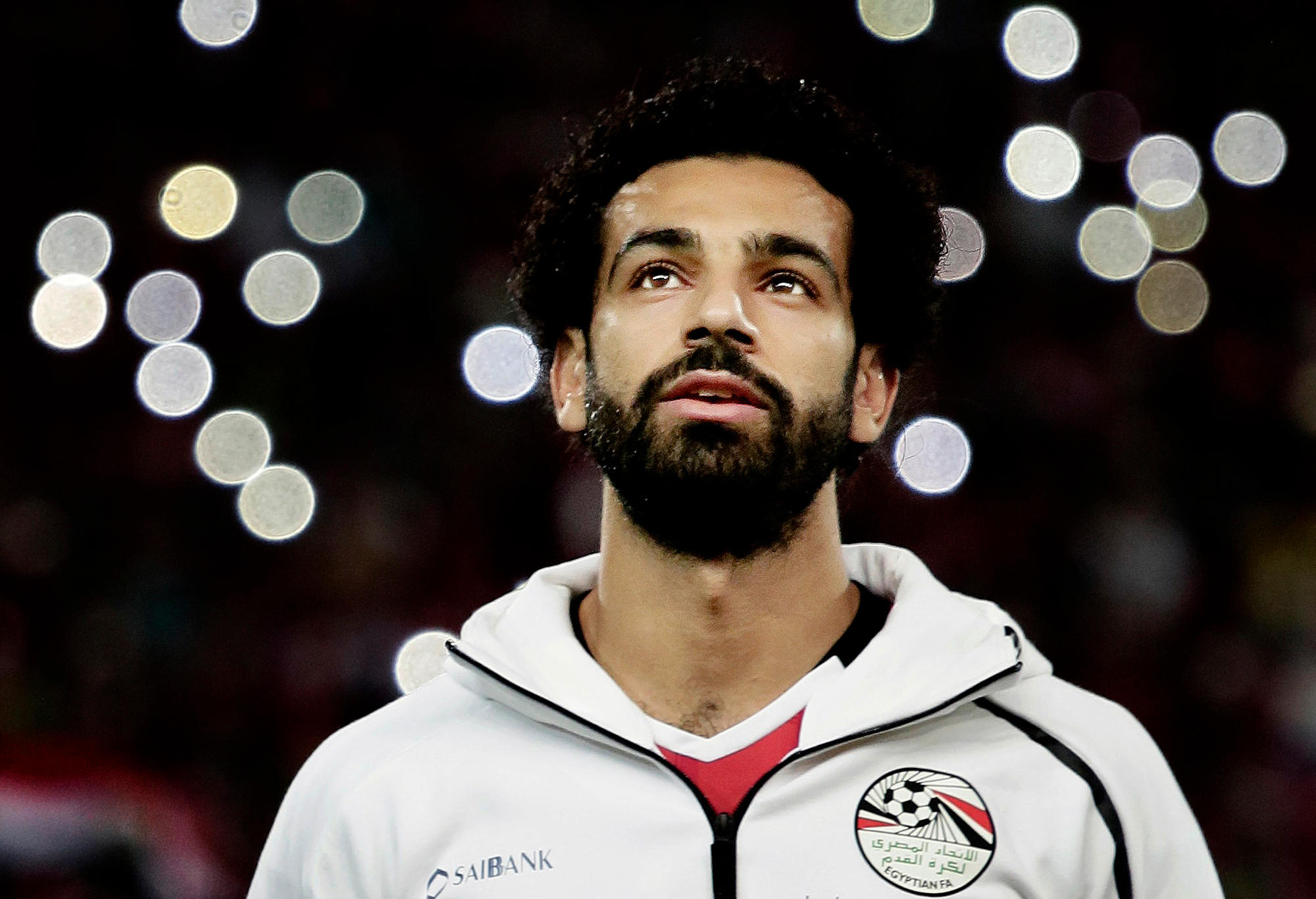 FILE - In this Oct. 8, 2017 file photo, Egypt's Mohamed Salah sings the national anthem before the 2018 World Cup group E qualifying soccer match between Egypt and Congo at the Borg El Arab Stadium in Alexandria. Egypt’s first World Cup warmup will be against Portugal, a match that could have two of the most prolific scorers in soccer going up against each other. The Egyptians, who will play at the World Cup for the first time in 28 years, will be led by Salah.