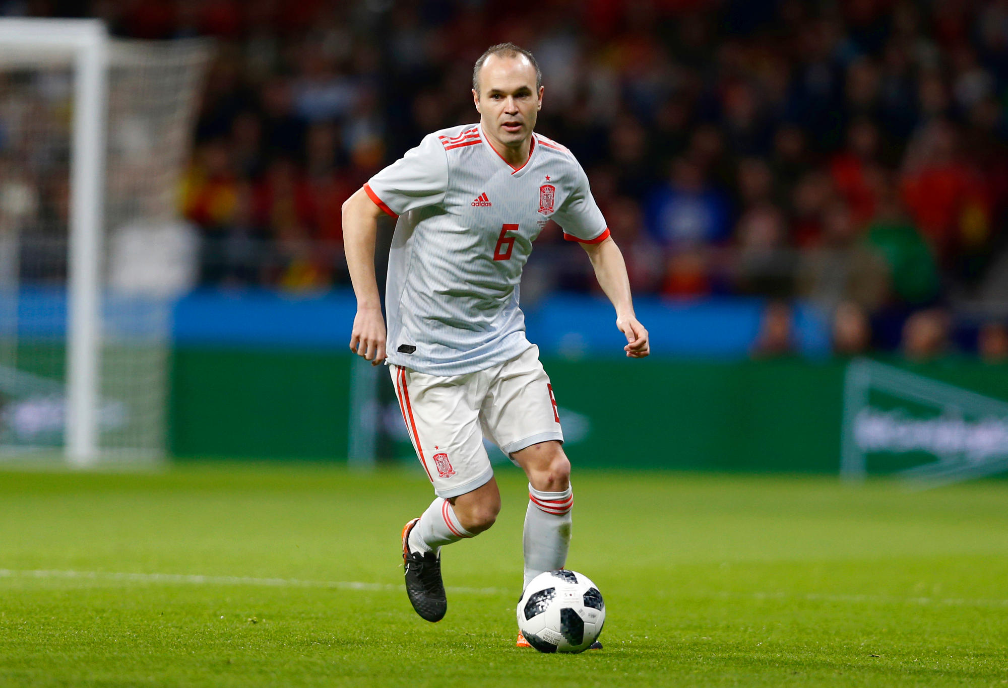 Andres Iniesta dribbles the ball for Spain