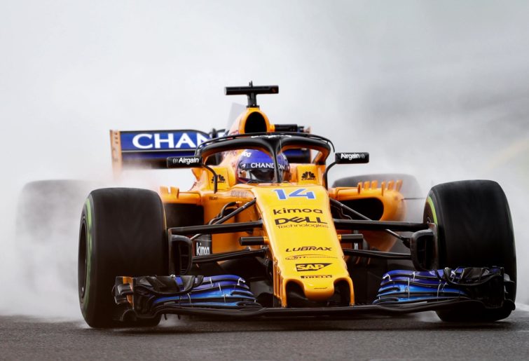 Fernando Alonso drives through a cloud of smoke at the 2018 Australian Grand Prix.