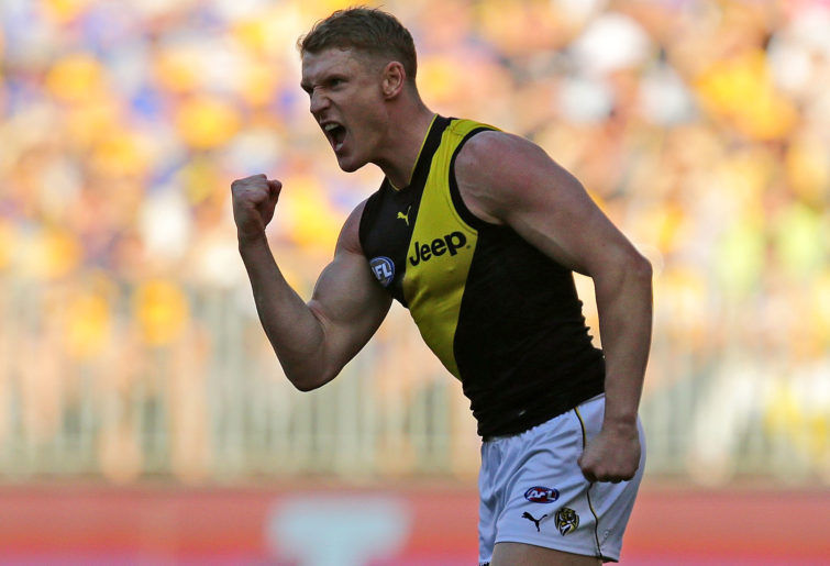 Josh Caddy of the Tigers celebrates after scoring a goal