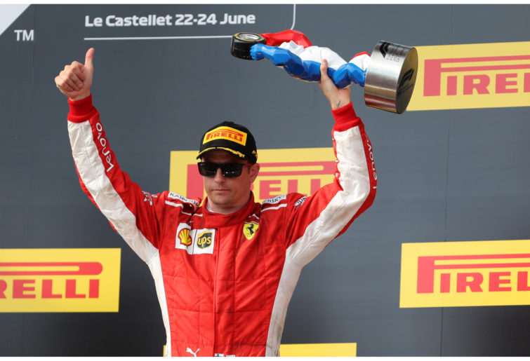 Ferrari's Kimi Raikkonen celebrates on the podium