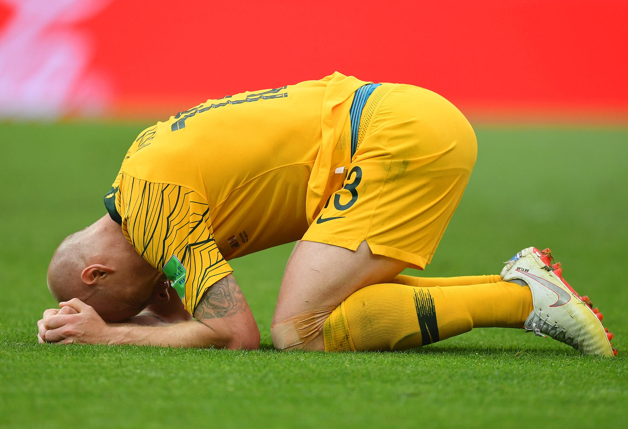 Aaron Mooy of Australia looks dejected following his side's defeat at the World Cup