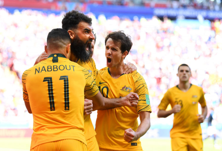 Mile Jedinak of Australia celebrates scoring a goal at the World Cup