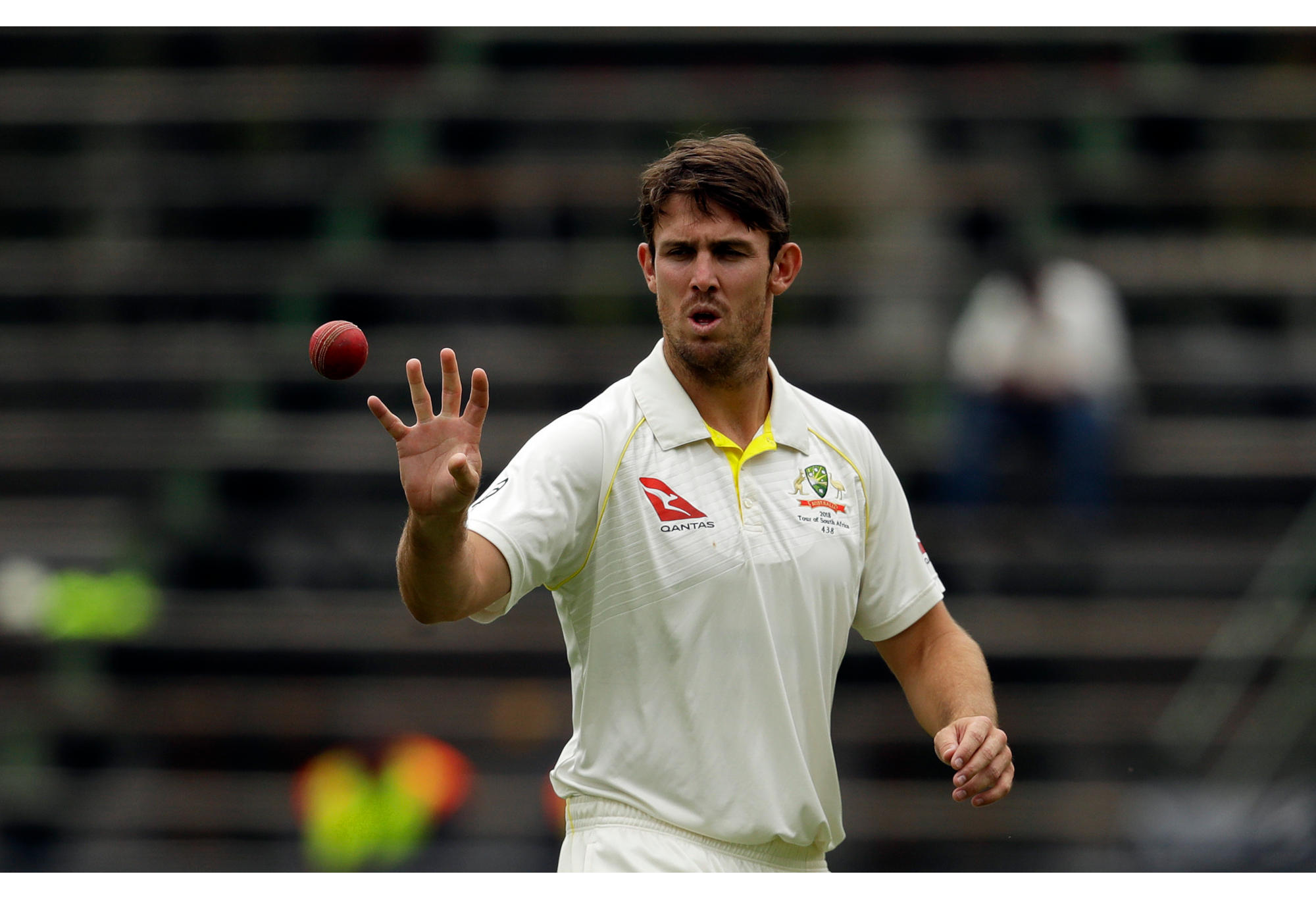 Australia's bowler Mitchell Marsh receives the ball as he prepares to bowl against South Africa.
