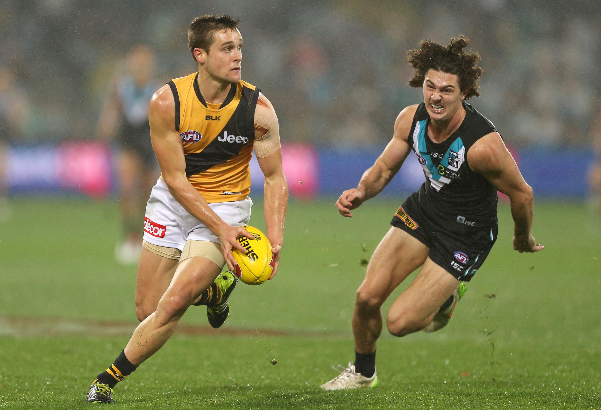 Jayden Short of the Tigers competes with Darcy Byrne-Jones of the Power during the 2016 AFL Round 15 match between Port Adelaide Power and the Richmond Tigers at Adelaide Oval on July 1, 2016 in Adelaide, Australia.