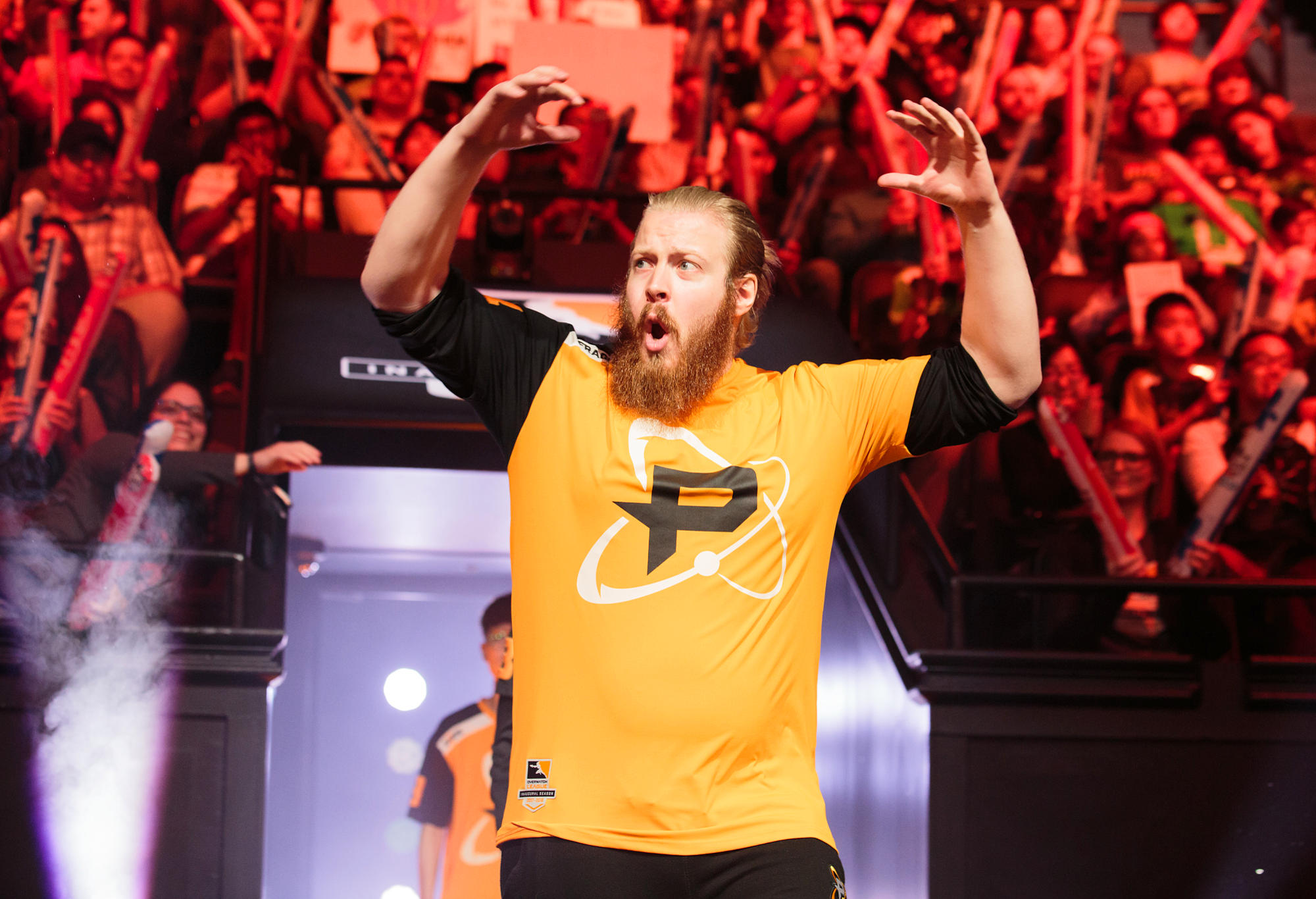 Joona "Fragi" Laine, of the Philadelphia Fusion esports team, pumps up the crowd before an Overwatch League game.